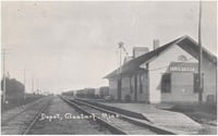 Black and white postcard showing the Great Northern Railway Depot and a grain elevator behind the depot in Clontarf, c.1880s.