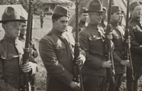Black and white photograph of Motor Corpsmen presenting arms at Camp Lakeview, Lake City, Minnesota, September, 1918.