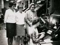 Black and white photograph of three West Publishing Company employees, c.1965.