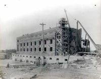 Construction of the power plant at the north end of the Coon Rapids Dam.