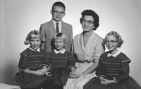 Black and white photograph of Carol Thompson with her children, Margaret, Amy, Patty, and Jeff, c.1961.