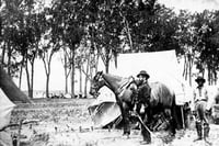 Black and white photograph of Major Brackett and his aide, Van Garren, at a camp in Dakota Territory, 1864.