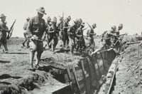 Black and white photograph of candidates jumping over an entrenchment at the Officers’ Training Camp, Fort Snelling, 1917.