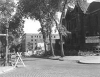 Black and white photograph of St. Paul's Central Park, c.1956. Its view looks south along Central Park Place West the former Blood mansion is in the foreground.