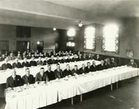Black and white photograph of a Lions Club meeting at Northeast Neighborhood House, 1926.