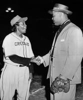 Black and white photograph of Toni Stone meeting her idol, boxer Joe Louis, c.1949.