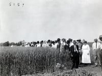 Black and white photograph of a group touring Northwest Experiment Station.