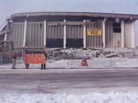 Demolition of the Met Center (Metropolitan Sports Center) in Bloomington, 1994. The stadium was demolished after the North Stars hockey team left Minnesota. A common refrain among North Stars fans, who blamed owner Norm Green for abandoning the state, was “Norm sucks.”