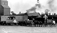Photograph postcard depicting a shipment of butter produced by Farmers Cooperative Creamery in Milaca, c.1915.