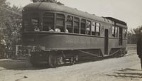 Black and white photograph of cars on Dan Patch line of Minneapolis, St. Paul, Rochester & Dubuque Traction Company, 1910.