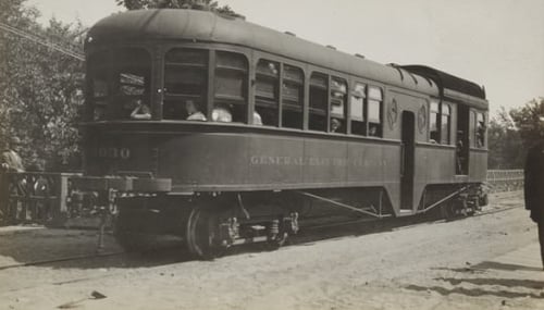 Black and white photograph of cars on Dan Patch line of Minneapolis, St. Paul, Rochester & Dubuque Traction Company, 1910.