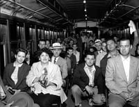 Black and white photograph of passengers on the last Minneapolis streetcar run, June 18, 1854. Photographed by St. Paul Dispatch & Pioneer Press.