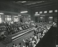 Black and white photograph of speaker’s stand and crowd at the 100th anniversary celebration of the Great Northern Railway at St. Paul’s Union Depot, 1962.