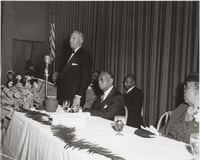 Black and white photograph of a Frank Boyd testimonial dinner, with A. Philip Randolph standing, 1951.