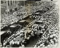 Black and white photograph of the funeral of Henry Ness, a striker killed during the strike, in front of strike headquarters at 215 South Eighth Street, Minneapolis, 1934.