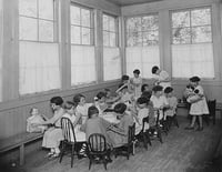 Black and white photograph of girls with dolls at the Emanuel Cohen Center in Minneapolis c.1925.
