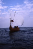 Color image of the Hjemkomst and crew on open water during their voyage to Norway, 1982. From the Tom Asp Collection, Historical and Cultural Society of Clay County.