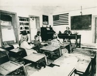 Volunteer teacher inside Huset School