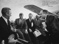 Black and white photograph of President John F. Kennedy at the Duluth airport with Senator Eugene McCarthy, Representative Donald Fraser, Governor Karl Rolvaag, and Senator Hubert H. Humphrey, 1965.