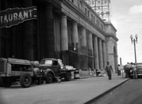 Black and white photograph of Workmen cleaning Minneapolis Great Northern Depot, 1944.