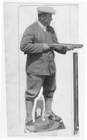 Wilford Captain Billy Fawcett with a trapshooting shotgun. Fawcett captained the U.S. trapshooting team at the 1924 Olympics