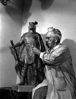 Sculptor John Karl Daniels with a model of his Leif Erikson statue