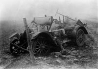 Black and white photograph of the ruins of a car after fire, Kettle River Road, 1918.