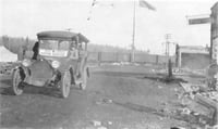 Black and white photograph of Red Cross Motor Service car providing relief efforts after the October fires of 1918.