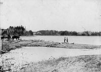 Black and white photograph of Jacob Brower at the Lake Itasca basin at DeSoto Lake, 1889.