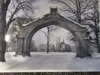 Black and white photograph of Shattuck School, Faribault, c.1949. The arch and Shumway, designed in 1886, and Morgan Refectory designed in 1888.