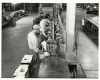Workers on the factory line at the Twin Cities Ordnance Plant