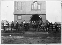 The Hinckley fire house, firemen, and Waterous steam fire engine, before September 1, 1894. The steam fire engine was manufactured in South St. Paul.