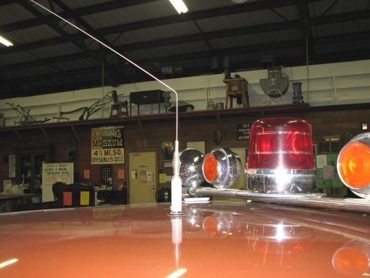 One of the two bent radio antennas on the roof of Johnson's squad car. The roof antenna was bent about 60 degrees starting six inches above its base while the front fender antenna was left undamaged.