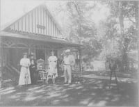 Photograph of four people in front of Villa Marie in Waconia. From left to right: Mrs. Emile Amblard her mother, Mrs. Wood Lillian Osterfelt Mr. Emile Amblard.