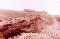 Black and white photograph of a compressional ridge near archway, 1909.