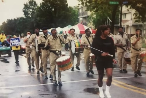 Color image of the Sabathanites Drum Corps marching in parade in Minneapolis, ca. early 2000s. Photographed by Suluki Fardan.