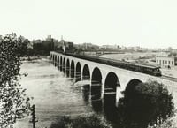 Train on the Stone Arch Bridge crossing the Mississippi River, Minneapolis mill