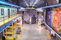 Color image of the front face of the MINOS far detector. On the left is the control room on the right is a mural by Joseph Giannetti.