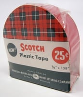 photograph of a plastic wrapped container of Scotch household tape