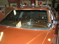 Cracked windshield of Val Johnson’s squad car