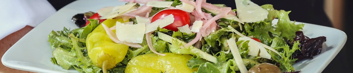 A salad on a white plate.