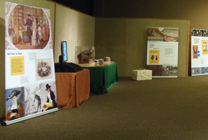 Several display boards and tables sit in the corner of a room.