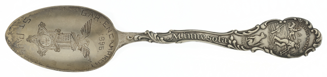 Close-up of the back of an engraved silver spoon
