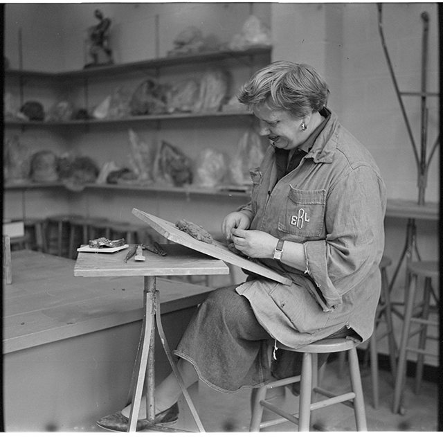 Evelyn Raymond working with clay in her Minneapolis studio, 1959
