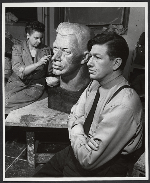 Evelyn Raymond sculpting a bust of Frederick Manfred, ca. 1945