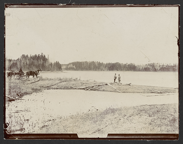 Black and white photograph of Jacob Brower at the Lake Itasca basin at DeSoto Lake, 1889.