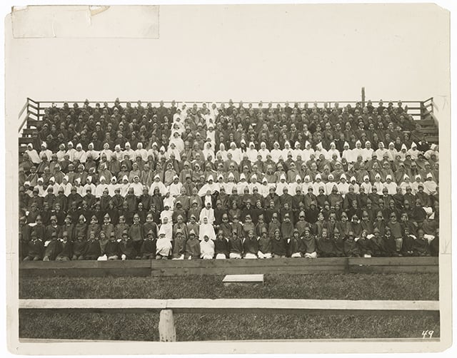 Chorus of singers forming the Norwegian Flag for the Norwegian Centennial Celebration