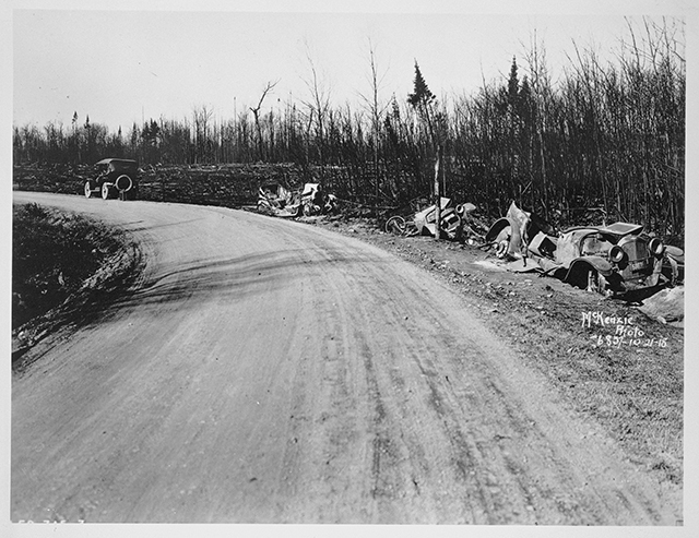 Black and white photograph of wrecked cars along Pike Lake Road near Duluth, 1918.