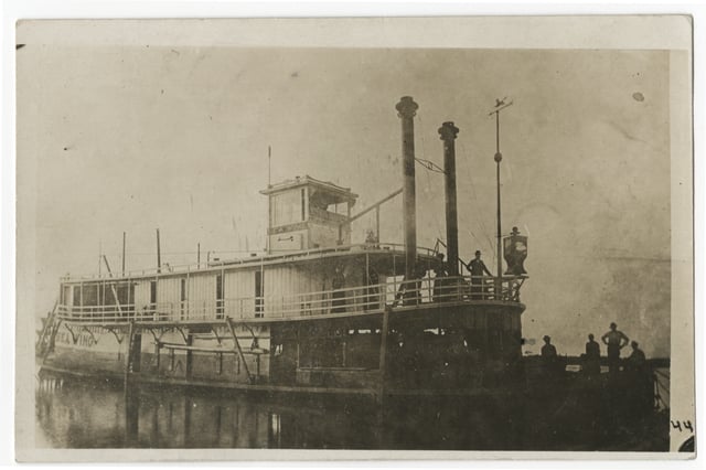 Black and white photograph of the Sea Wing, c.1889. Its owners typically used it as a work boat, often towing log rafts down the Mississippi.