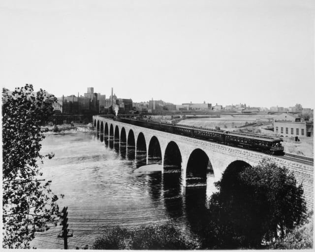 Train on the Stone Arch Bridge crossing the Mississippi River, Minneapolis mill
